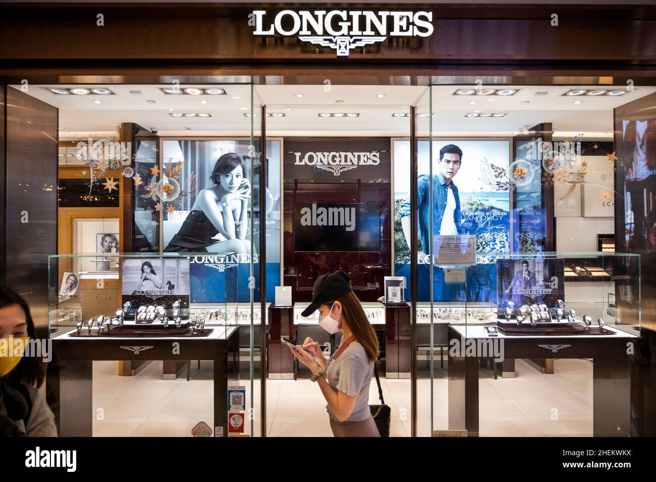 A shopper walks past the Swiss luxury watchmaker brand, Longines store seen  in Hong Kong. (Photo by Budrul Chukrut / SOPA Images/Sipa USA Stock Photo -  Alamy
