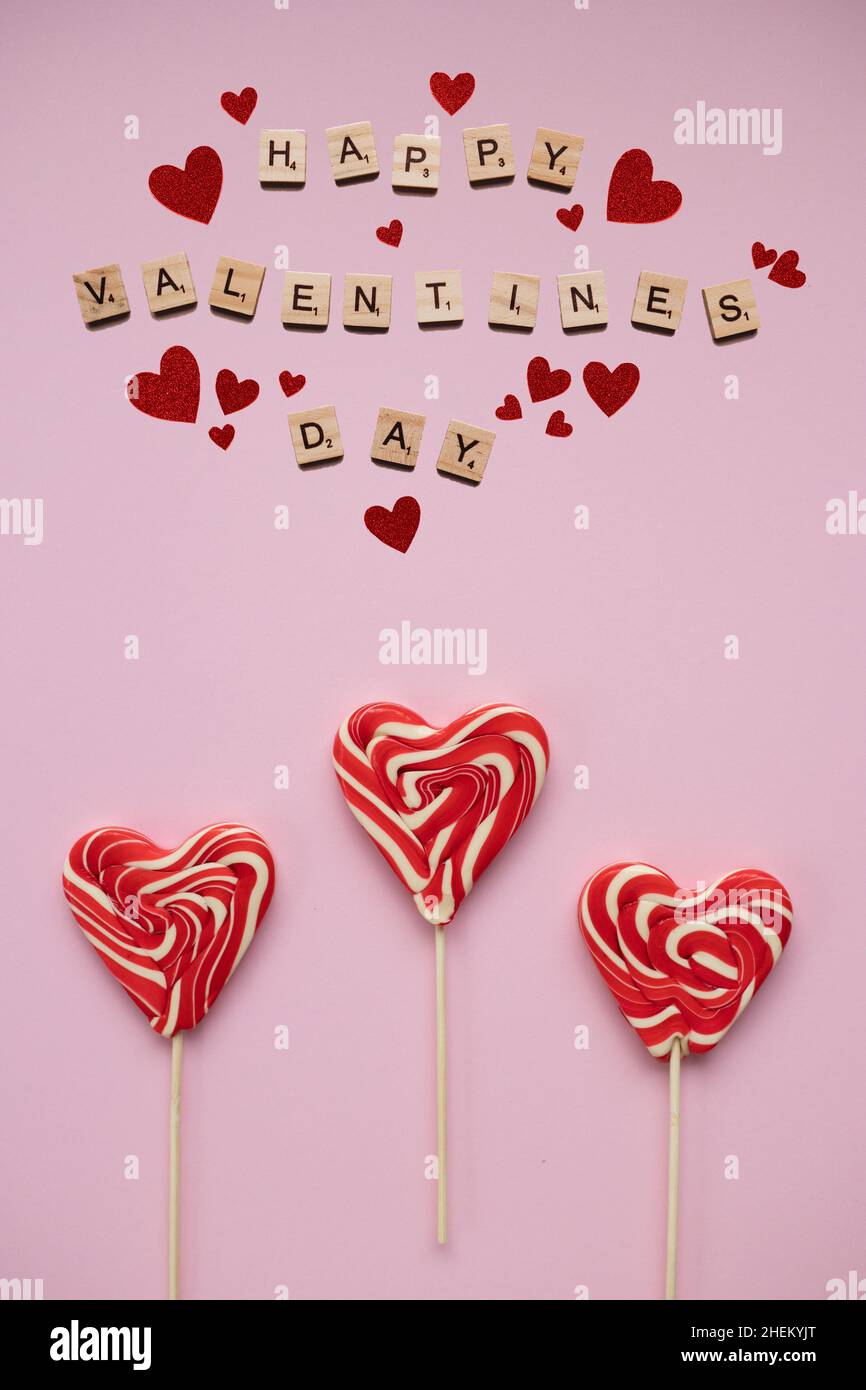 Happy valentines day with heart shaped candies, pink background Stock ...