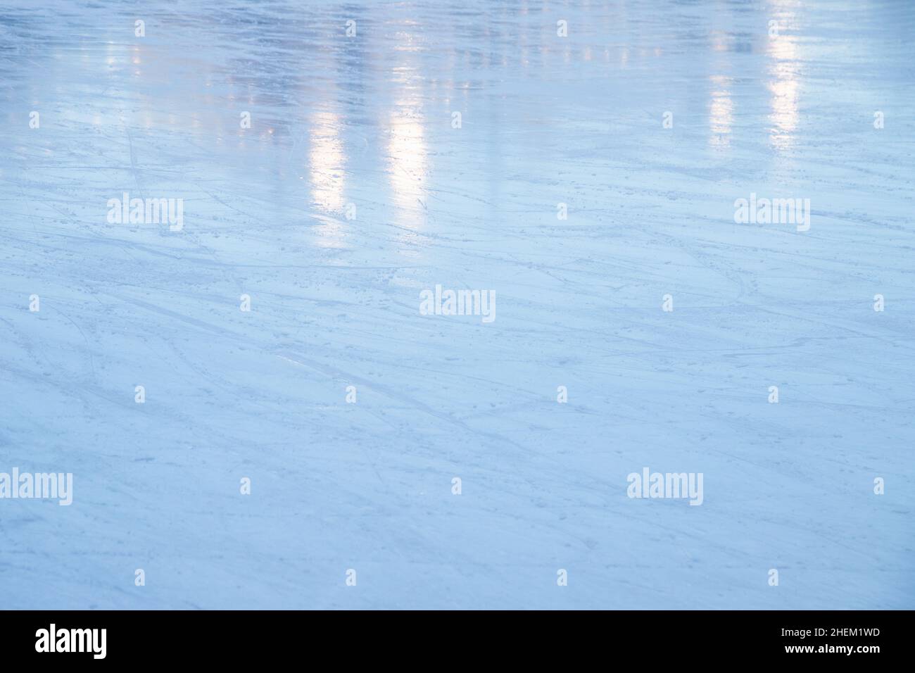 Light blue ice rink with reflections, abstract skating background texture Stock Photo