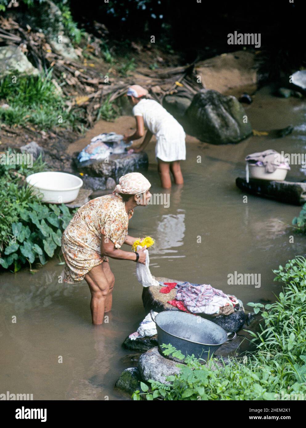 Indian women washing clothes village hires stock photography and