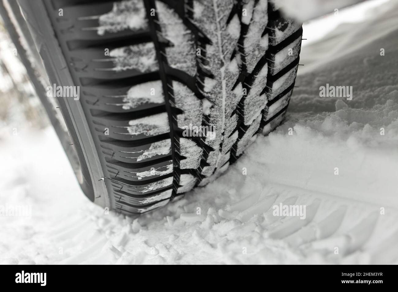 Winter Tire in Deep Snow with Deep Track Stock Photo
