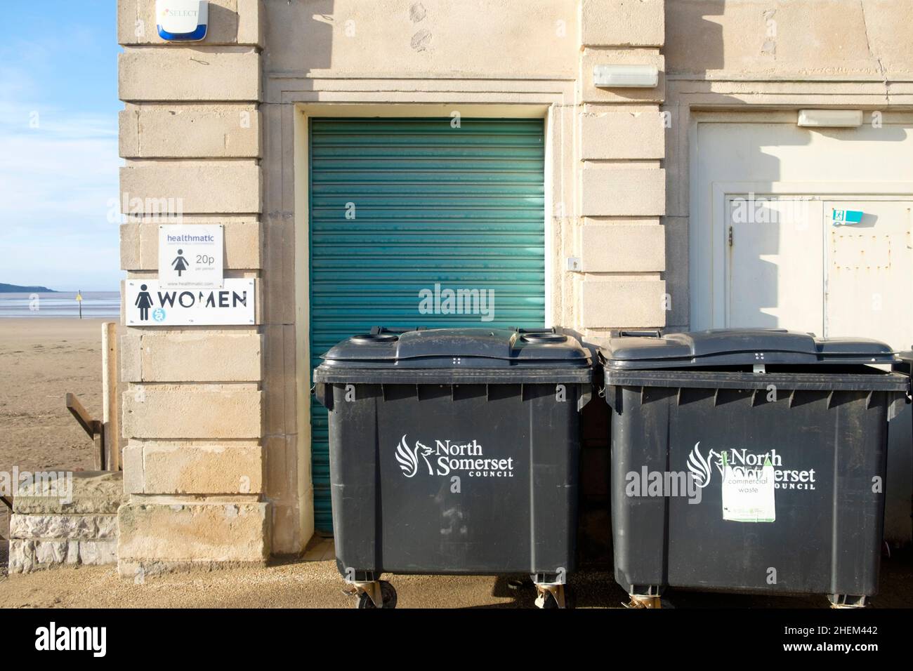 A Winters Day on the Promenade at Weston-super-Mare. The closed ladies toilets and bins. Off season Stock Photo