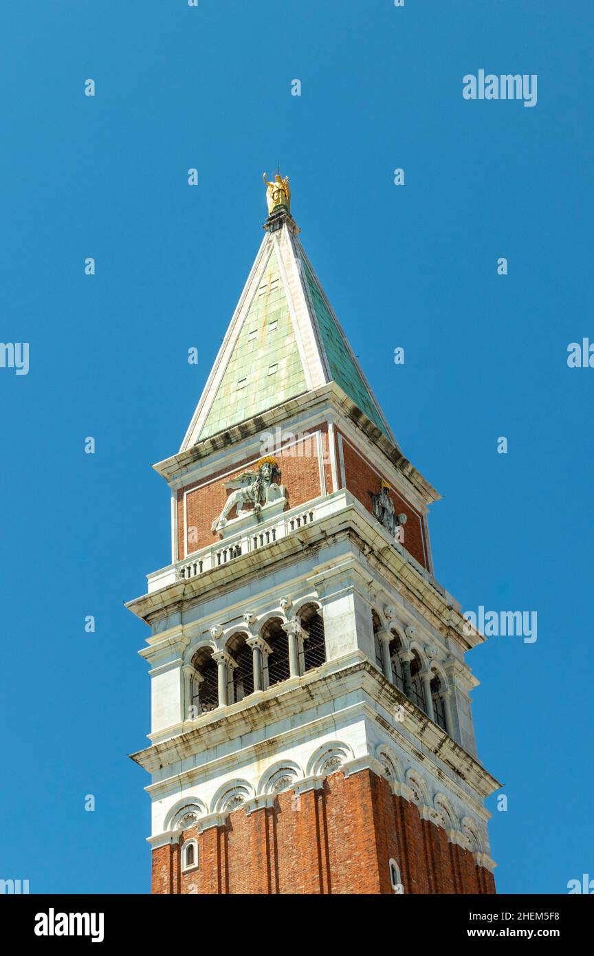 Attic of the bell tower with the lion of Saint Mark and the allegorical figure of Venice as Justice crowned and seated on a leonine throne, Venice Stock Photo