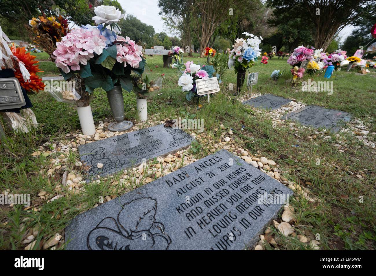 Austin Texas USA, October 21 2021: The grave sites of 'Baby Angels' in Assumption Cemetery. These are reserved for aborted fetuses and miscarriages in the Catholic cemetery south of downtown. ©Bob Daemmrich Stock Photo