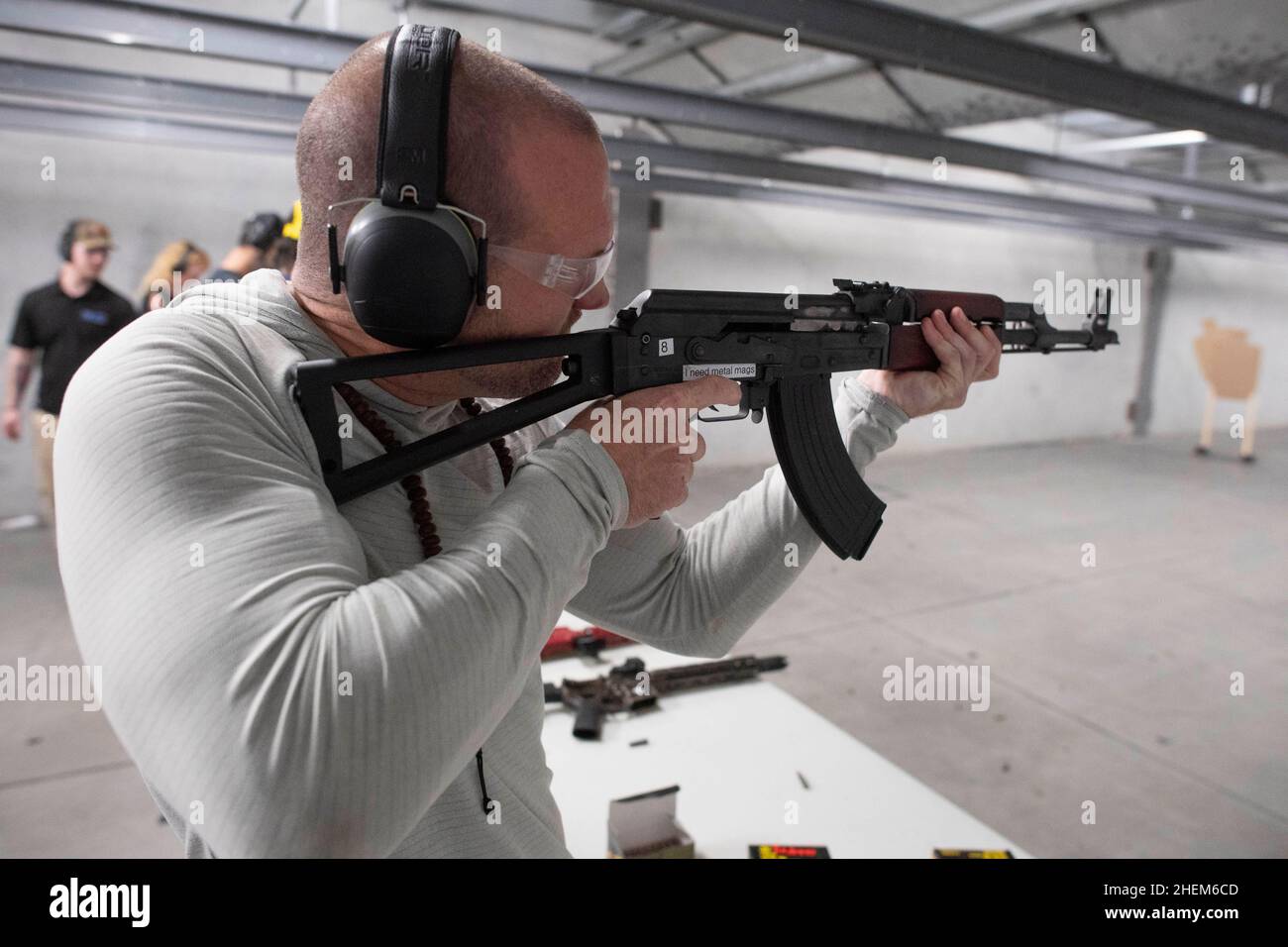 Austin Texas USA, October 23 2021: Bitcoin club member and organizer Kyle  Murphy shoots a Zastava 7.62 X 39 AK-47 style semi-automatic rifle at The  Range, an indoor shooting venue in south