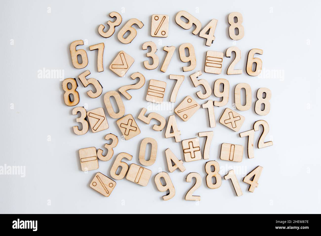 Wooden numbers symbols on white background. Randomly arranged numbers ...