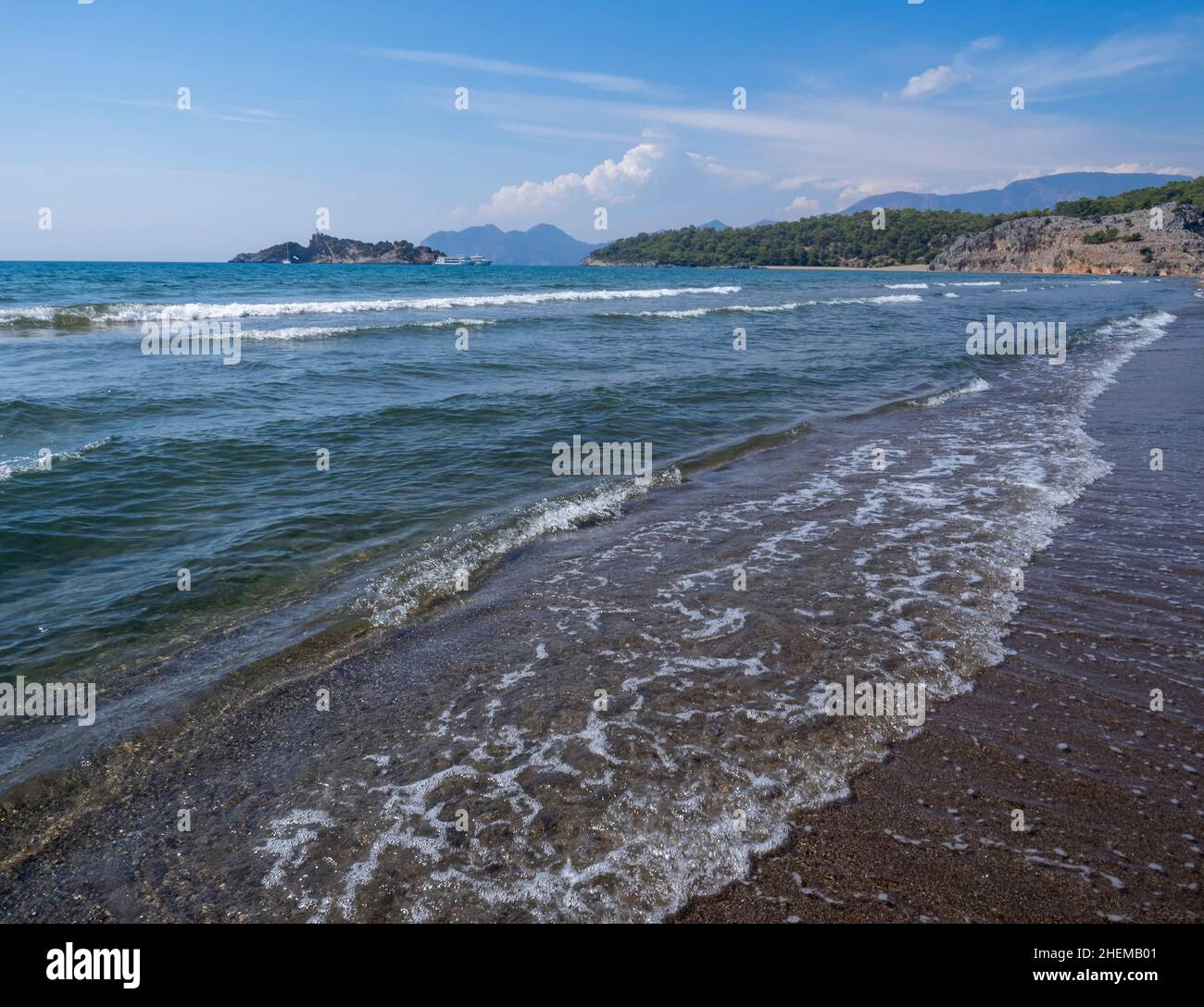 Wave of the sea on the sand beach with sunlight , for background Stock Photo