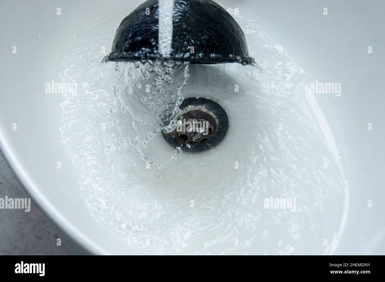 Cleans plunger with clogged sink, close up Stock Photo Alamy