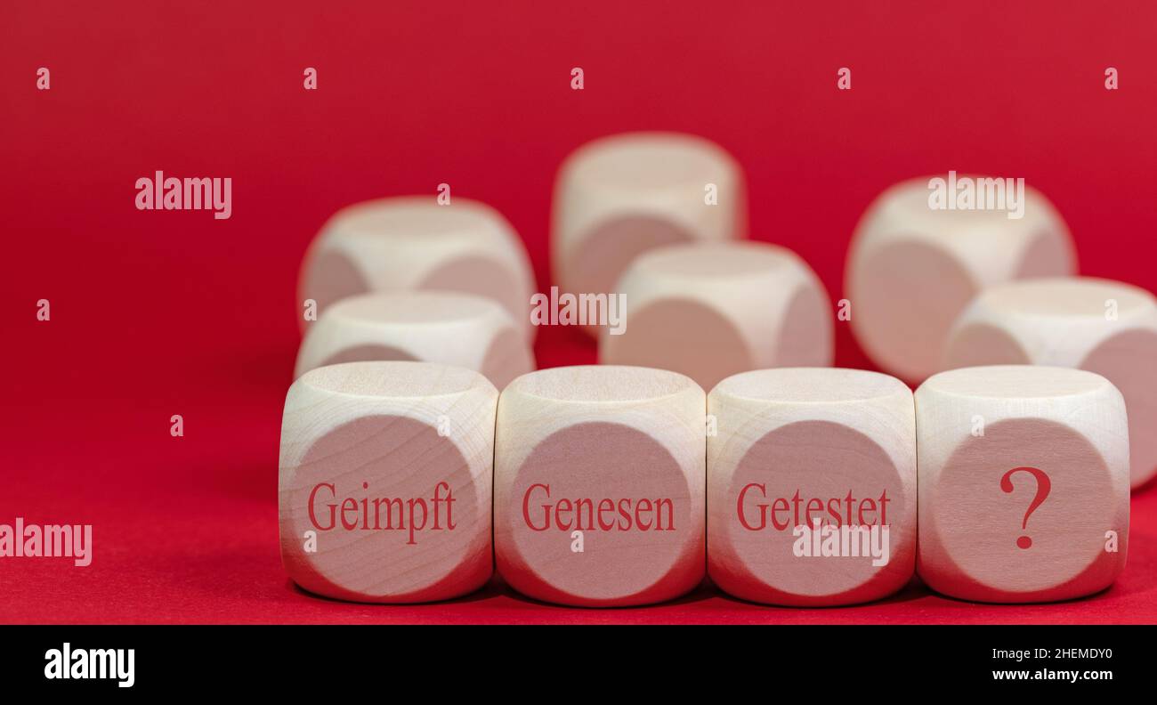 Wooden cubes with the imprint 'Geimpft,genesen,getestet', translation'Vaccinated, recovered, tested' Stock Photo