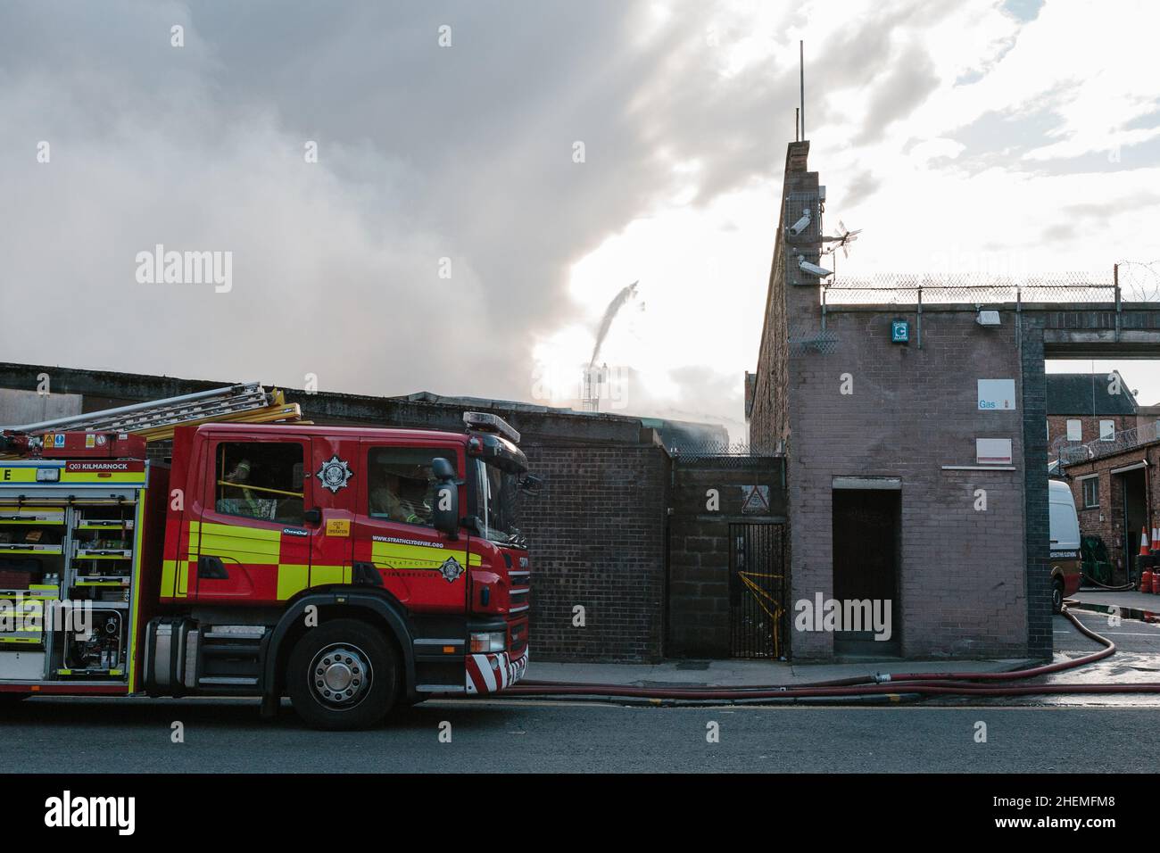 Fire crews fight the Alfa Warehouse fire on Lancefield Street in the city of Glasgow in April 2014. Stock Photo
