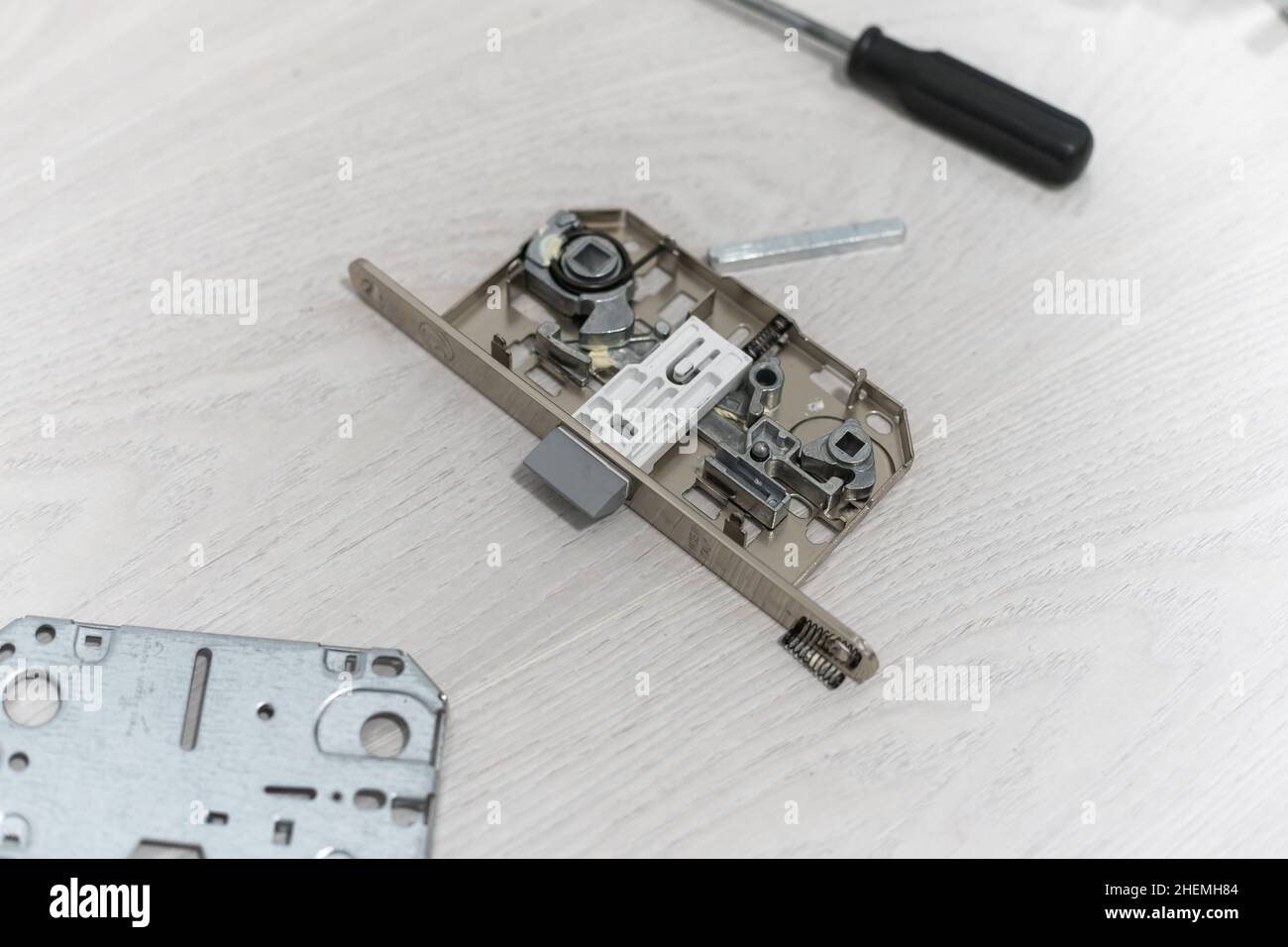 door lock repair. Assembly of aluminium door lock for adjustment or repair Stock Photo Alamy