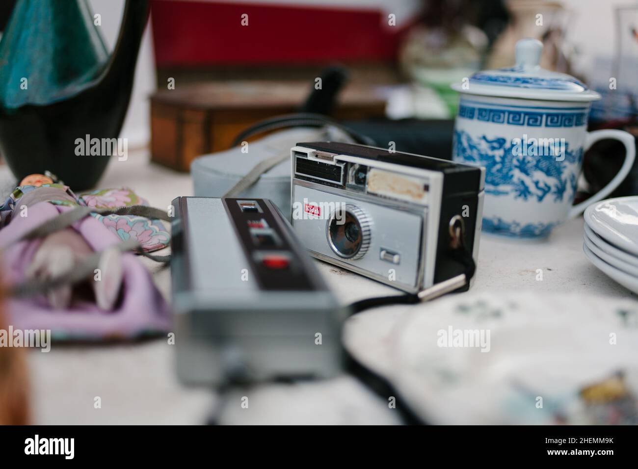 A vintage Kodak camera and other items for sale in a market stall on Byres Road, Glasgow, Scotland. Stock Photo