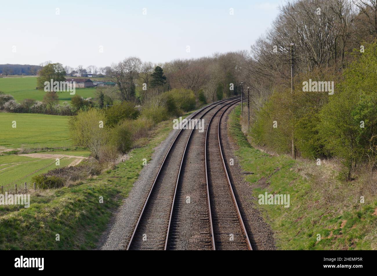Train tracks running through the countryside, England Stock Photo