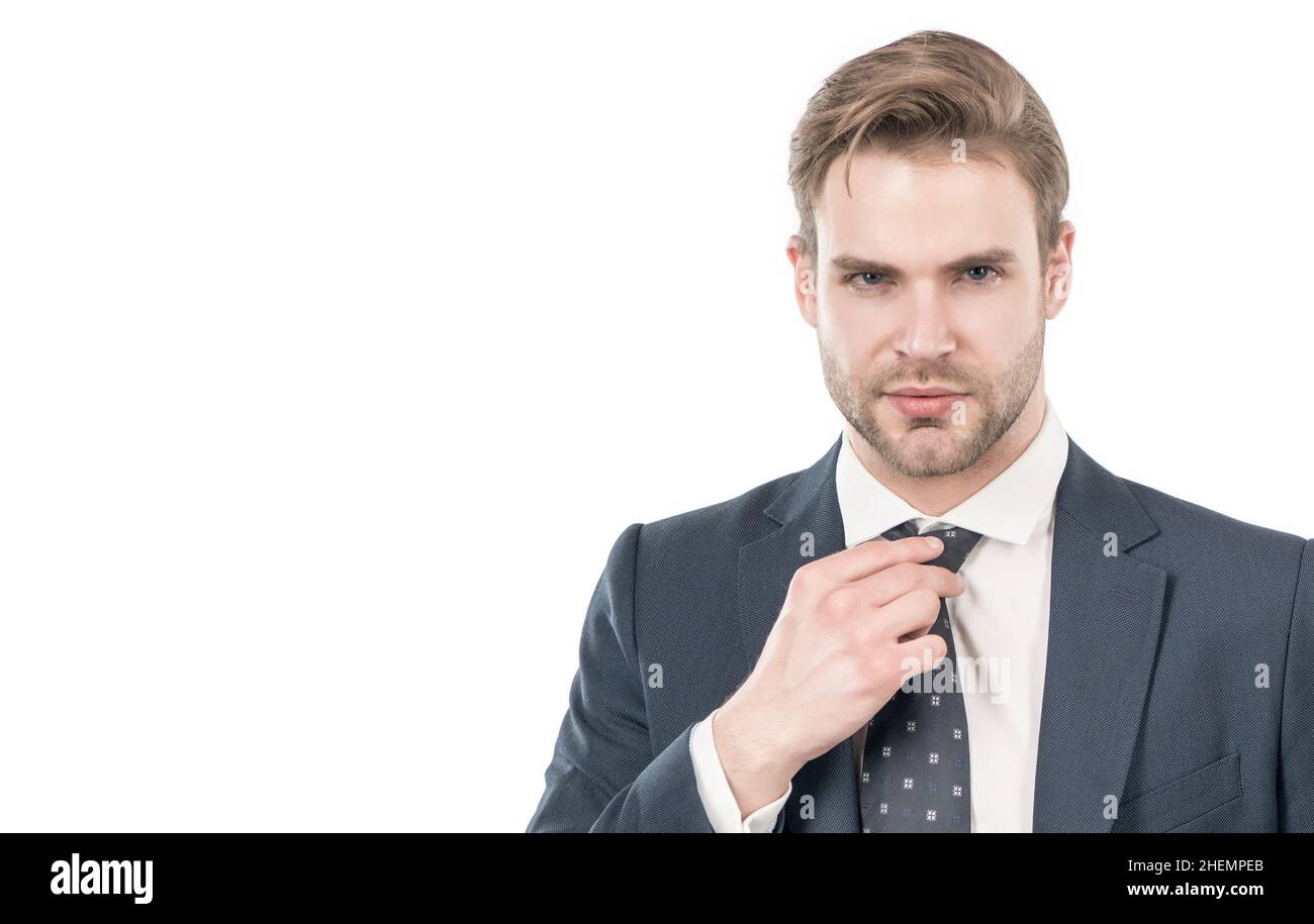 Portrait of serious professional man adjusting necktie in formal business suit, guy Stock Photo