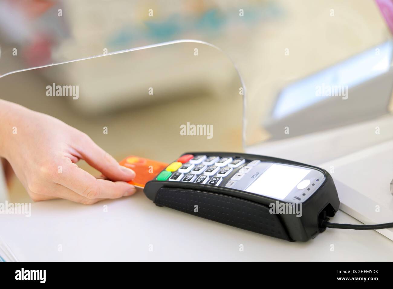 Moment of payment with a credit card through bank terminal machine ...