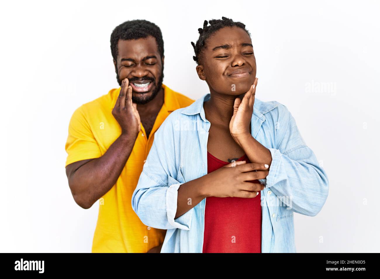 Young african american couple wearing casual clothes touching mouth ...