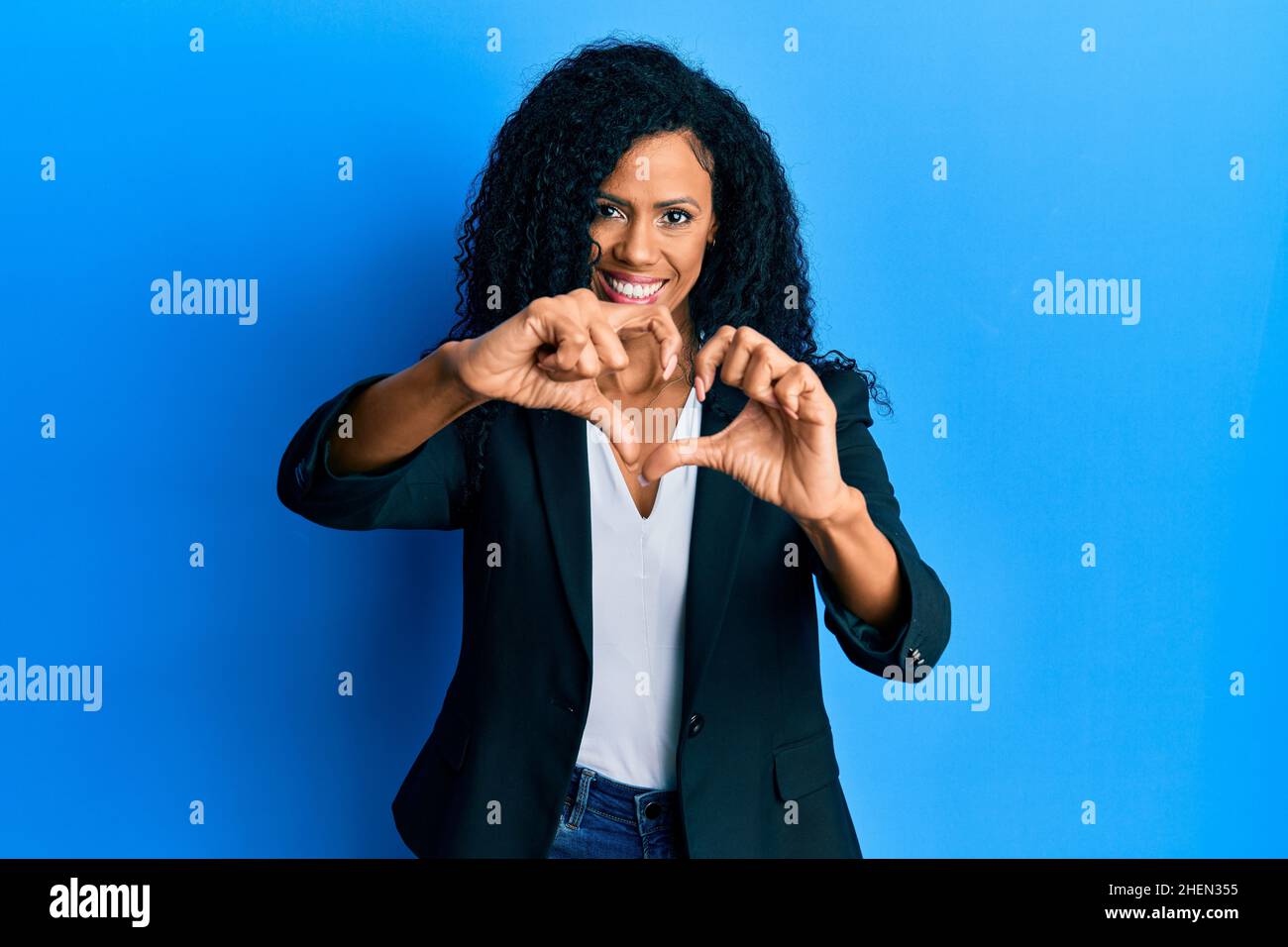 Middle age african american woman wearing business clothes smiling in ...