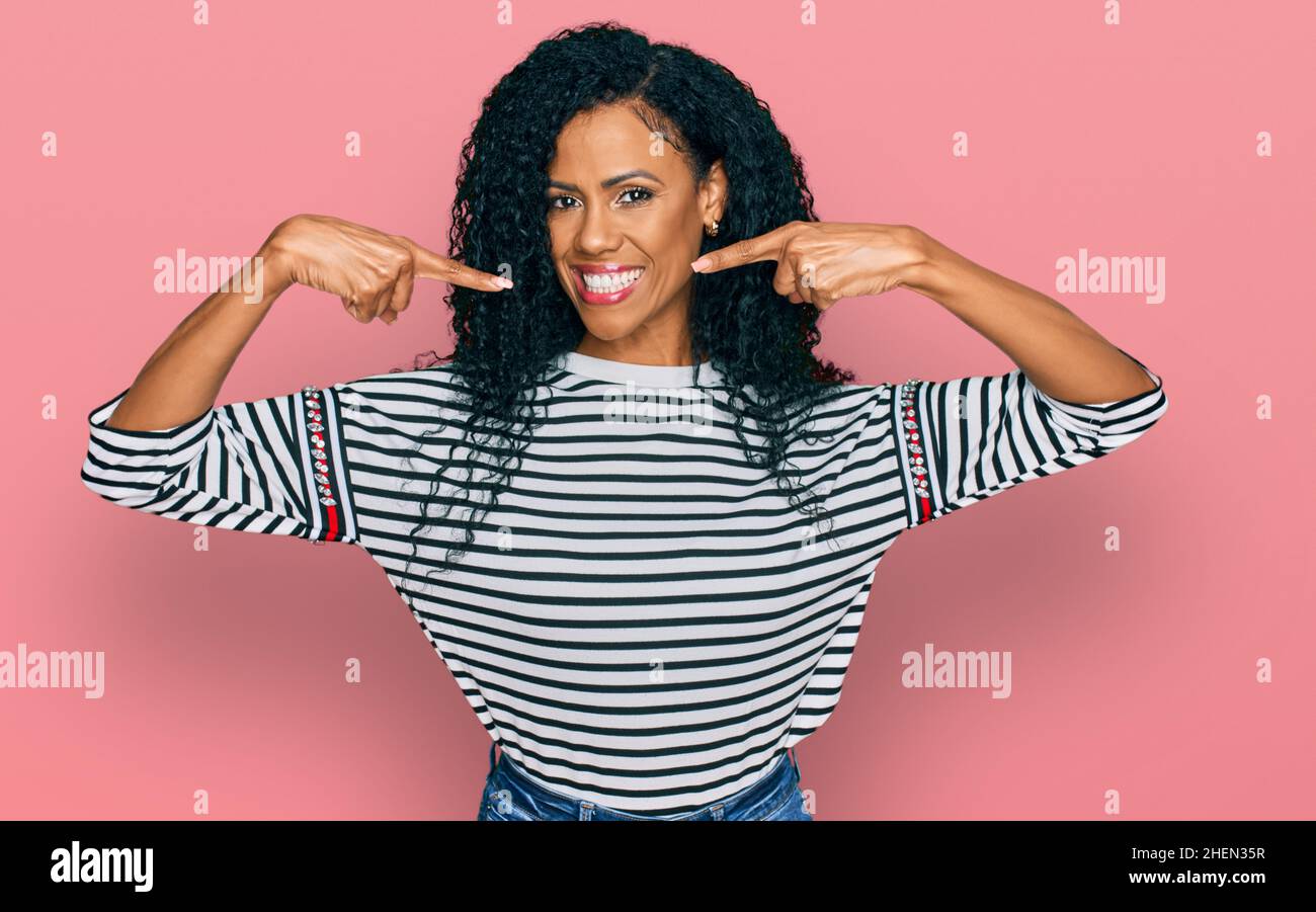 Middle age african american woman wearing casual clothes smiling ...