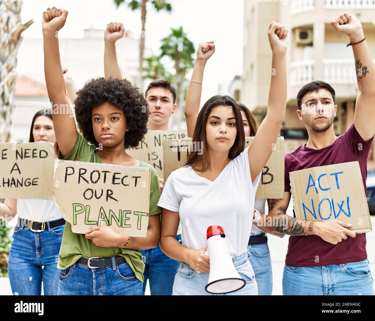 Interracial people protesting banner megaphone hi-res stock photography ...