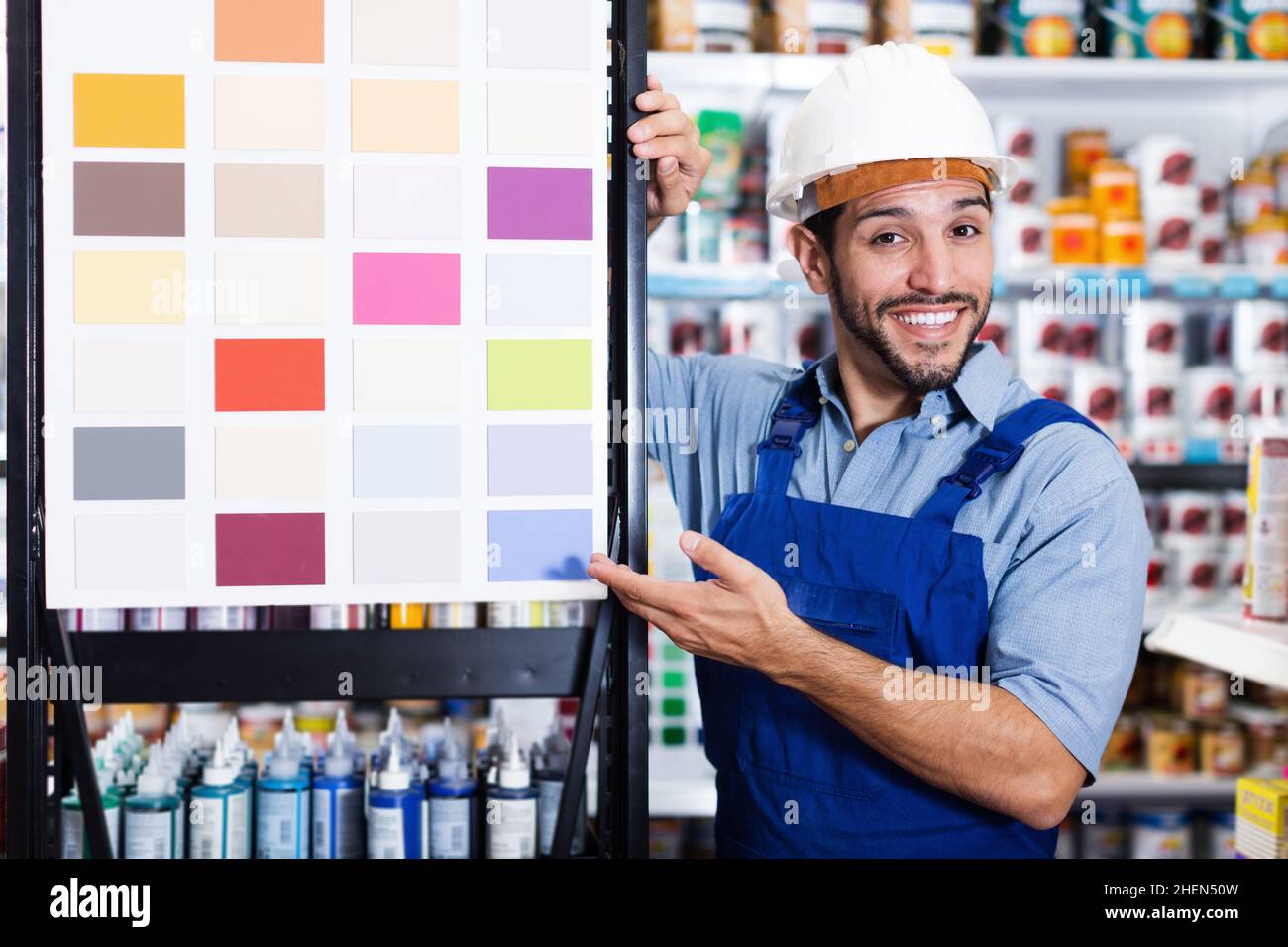 Professional painter showing stand with samples Stock Photo Alamy