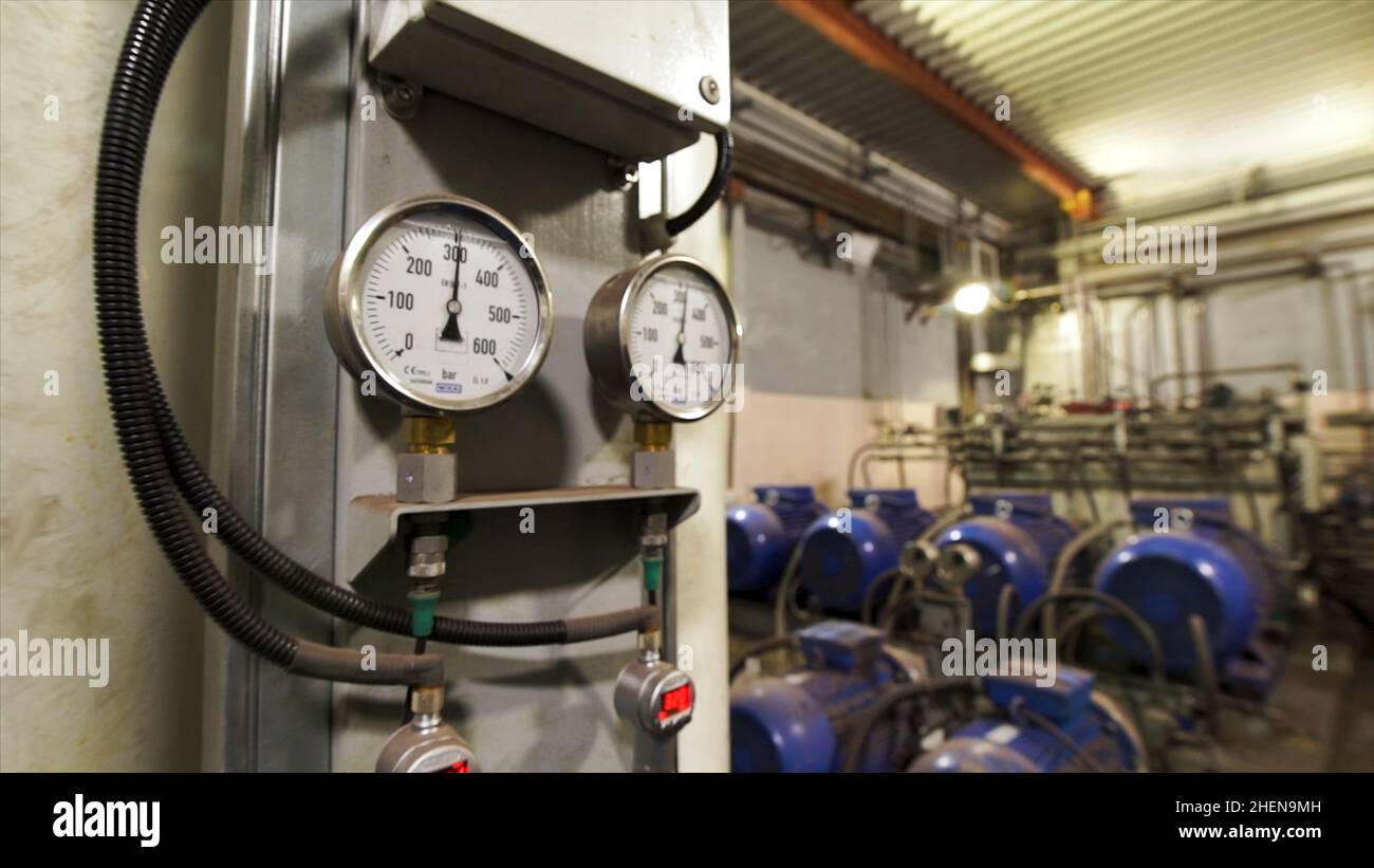 Large industrial boiler room, pipes of central heating system and water