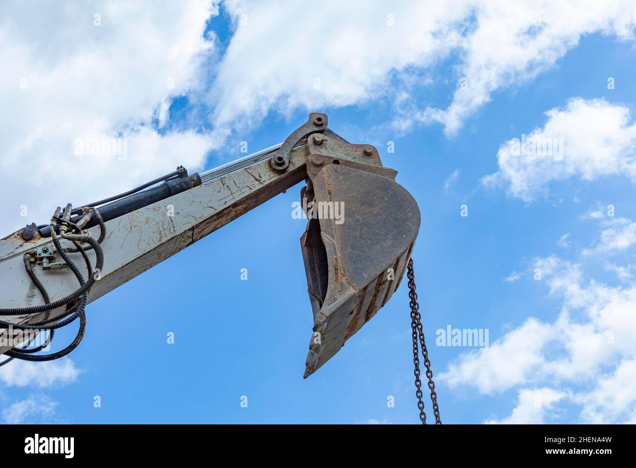 heavy excavator bucket under cloudy and blue sky in detail Stock Photo ...