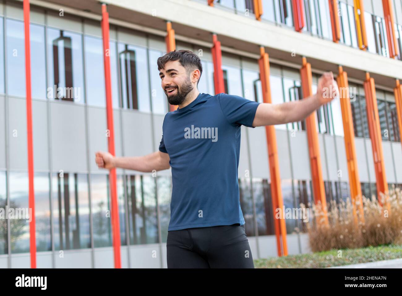 Young man doing their stretches before training. Stock Photo