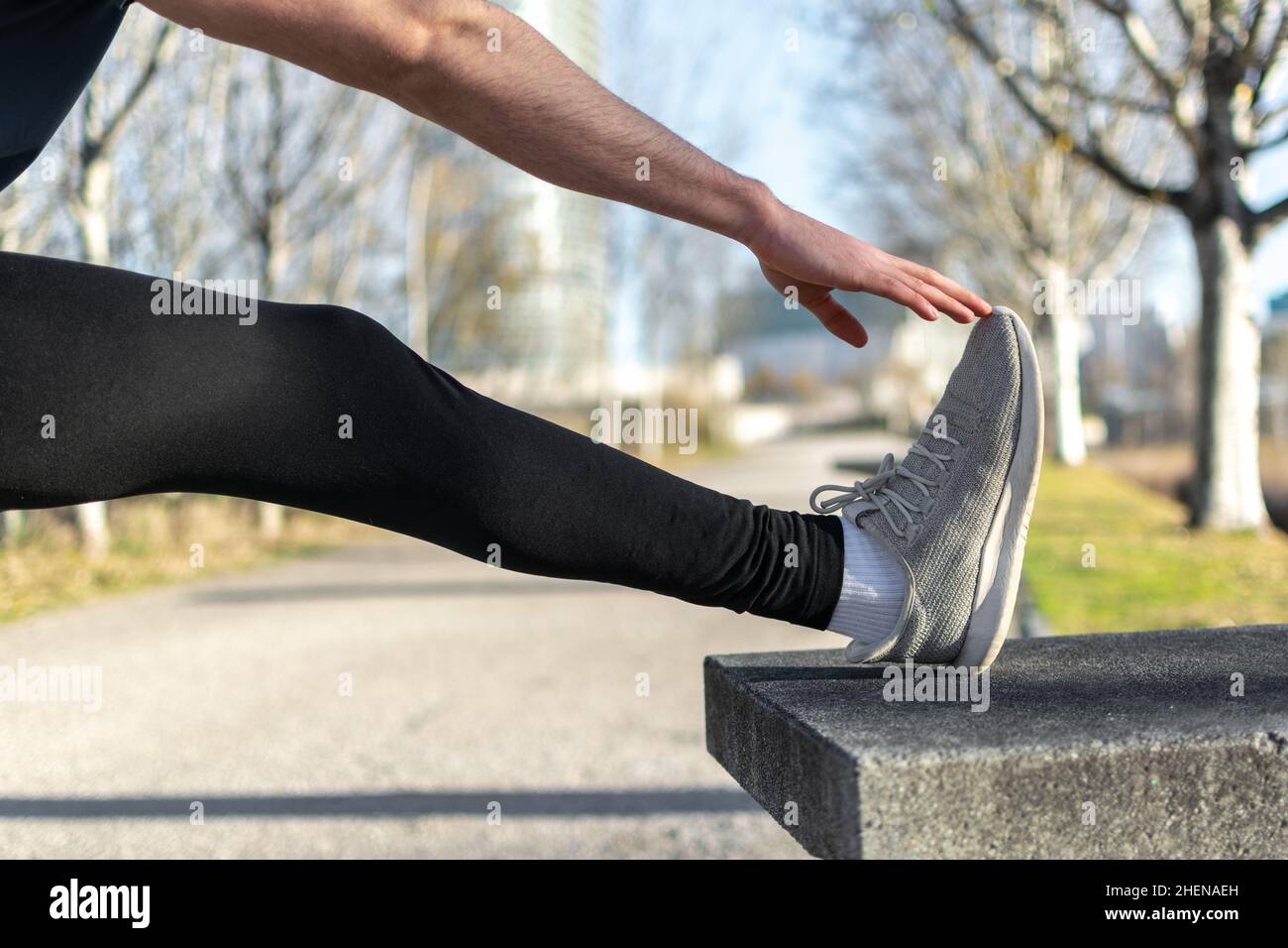 Runner stretching leg on rural hi-res stock photography and images - Alamy