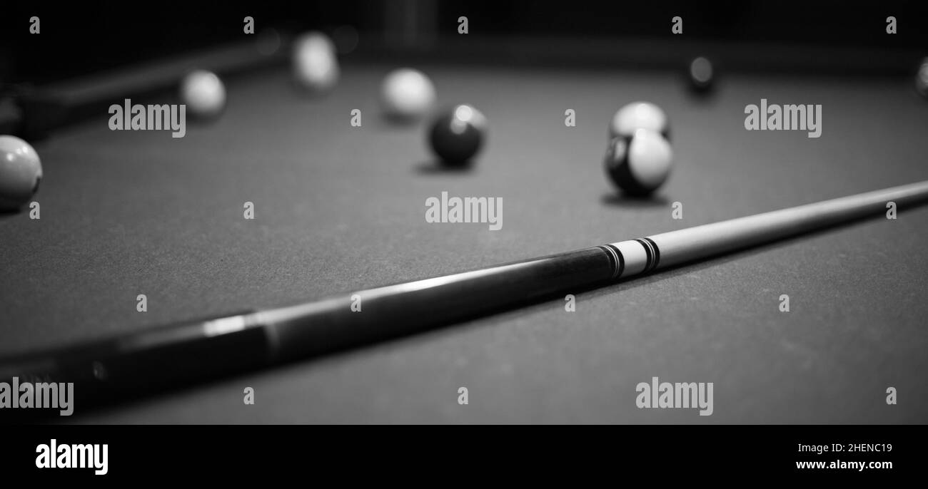 Billiard table in the billiard room with balls and cue Stock Photo Alamy