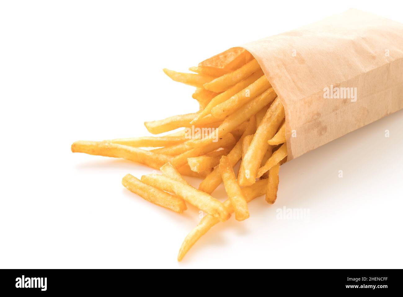 Golden French fries potatoes on white Stock Photo Alamy
