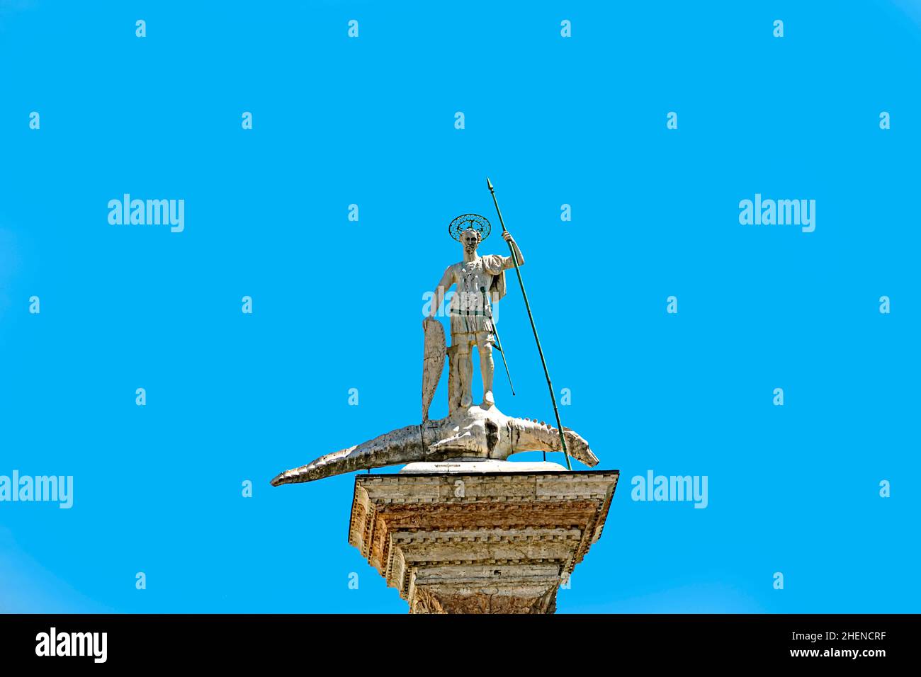 Close-up of St. Theodore's Column in St. Mark's Square with blue sunny ...
