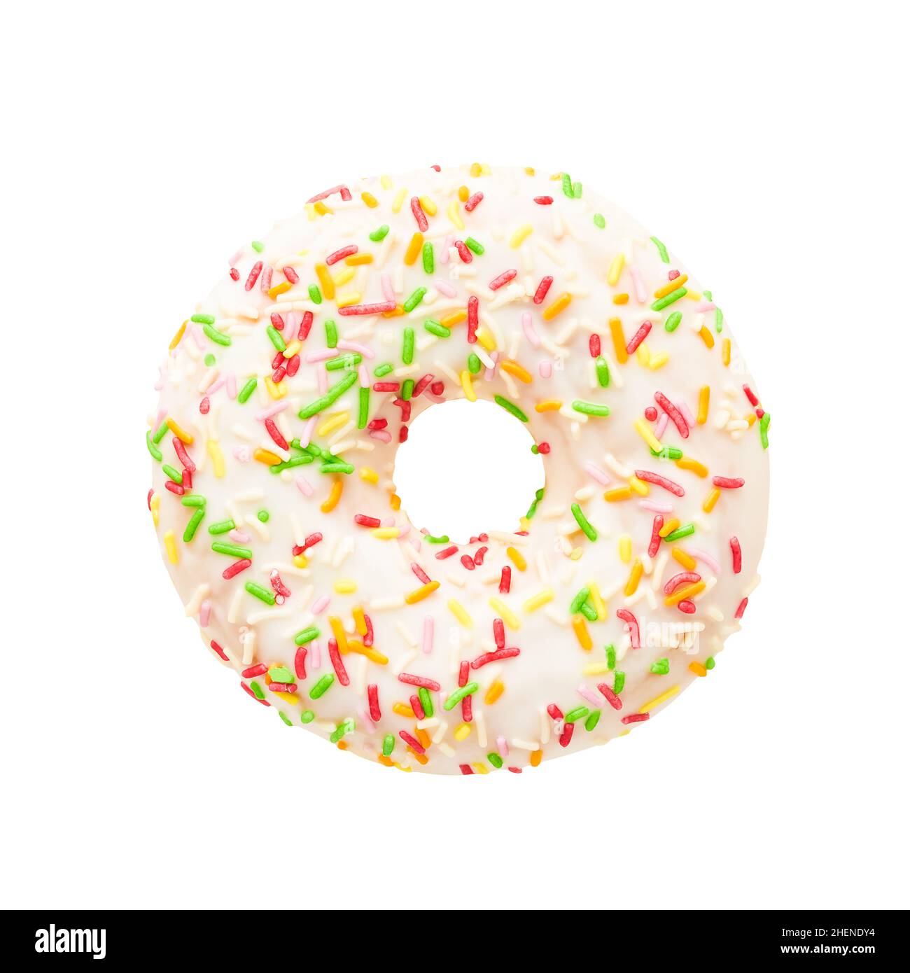 Donut in white glaze with colorful sprinkles isolated over white background with clipping path. Stock Photo