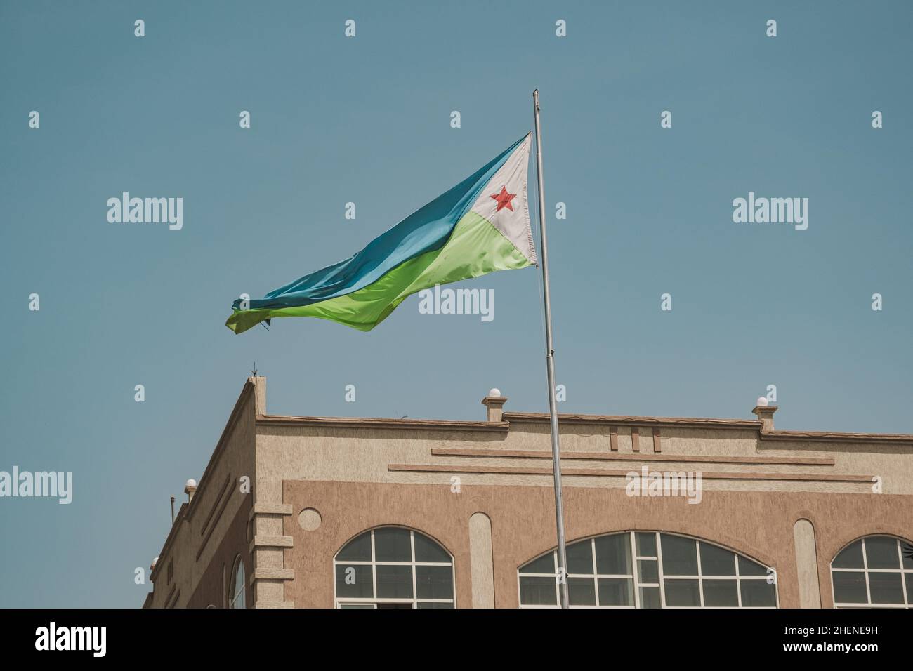 Djibouti, Djibouti - May 21, 2021: Djibouti flag waving in Djibouti. Editorial shot in Djibouti. Stock Photo