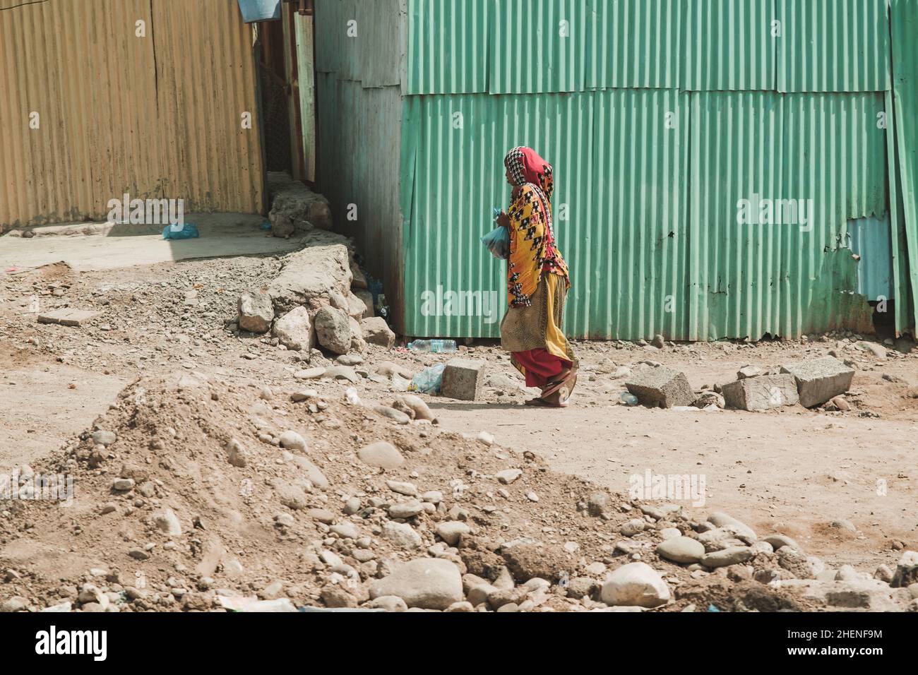 Djibouti, Djibouti - May 21, 2021: A Djiboutian woman walking in local dress in Djibouti. Editorial shot in Djibouti Stock Photo
