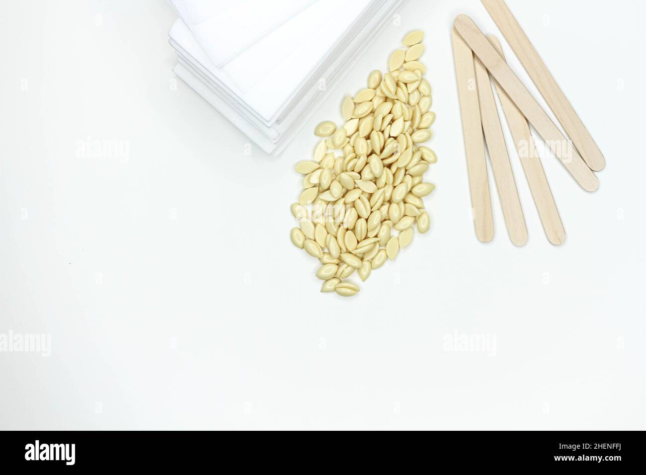 Hair removal wax. Wax strips for depilation. Spatula and wax granules
