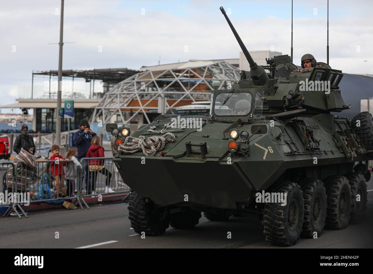 U.S. Marines with 1st Marine Division (1st MARDIV) drive a light armored vehicle in the San Diego County Credit Union Holiday Bowl Parade at San Diego, California, Dec. 29, 2021. The 1st MARDIV showcased vehicles and equipment to increase awareness of Marine Corps capabilities among the local community. (U.S. Marine Corps Photo by Lance Cpl. Brayden Daniel) Stock Photo