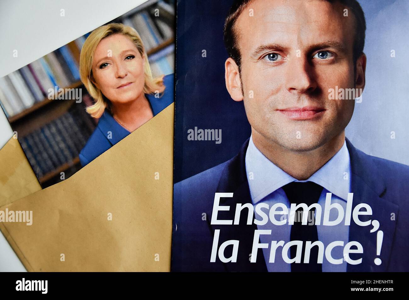 In this photo illustration, Marine Le Pen and Emmanuel Macron's ballot papers and election posters are seen displayed. While he is not yet officially a candidate for his re-election, the President of the French Republic, Emmanuel Macron is leading the polls for the presidential elections of 2022 with 27% of the voting intentions in front of the candidate of the National Rally (RN) Marine Le Pen (17.5%). The first round of the election of the President of the Republic will take place on April 10, 2022. (Photo by Gerard Bottino/SOPA Images/Sipa USA) Stock Photo