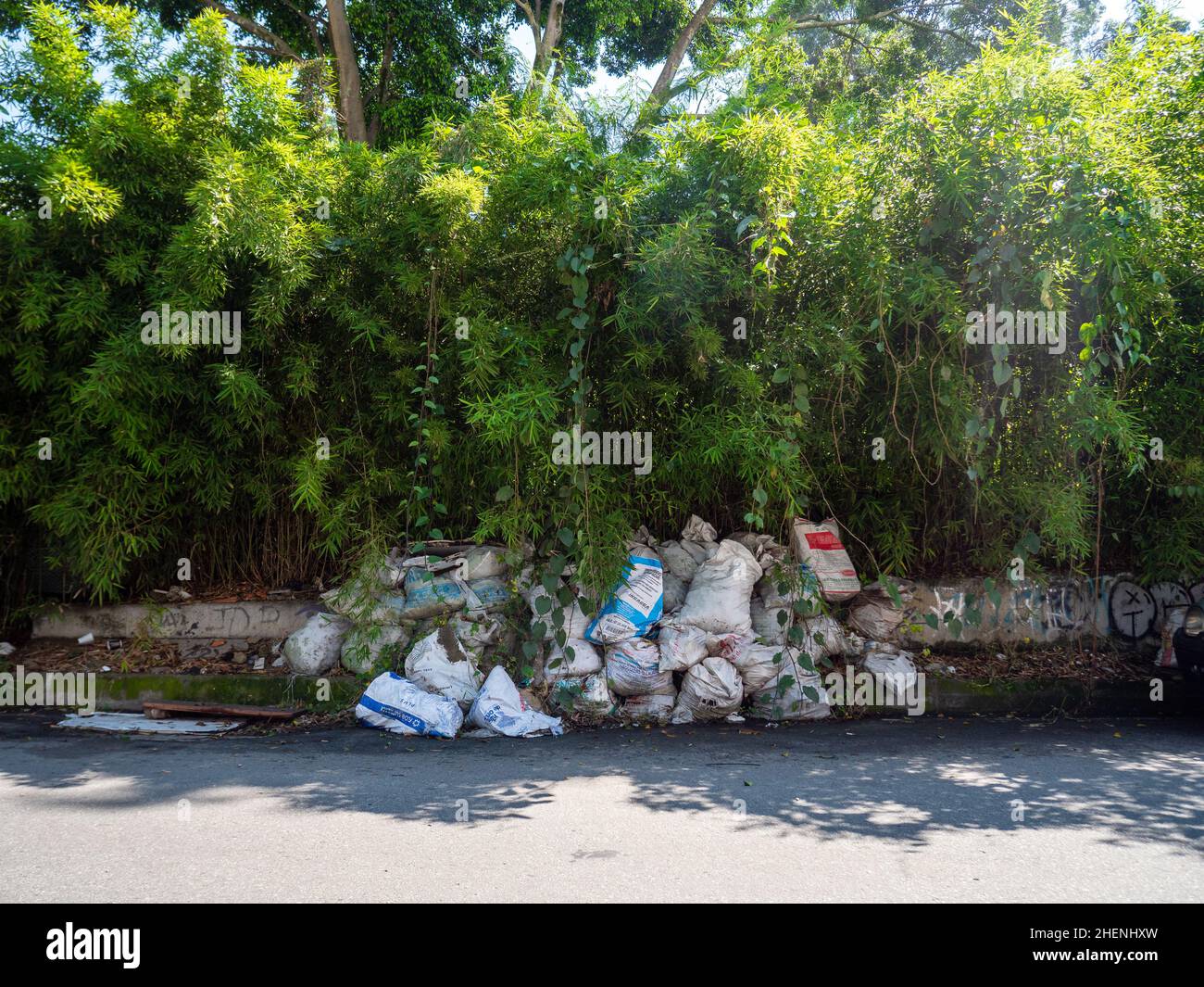 Medellin, Antioquia, Colombia - November 27 2021: Garbage Bags Accumulated on the Street Corner to be Picked up by the Collection Truck Stock Photo