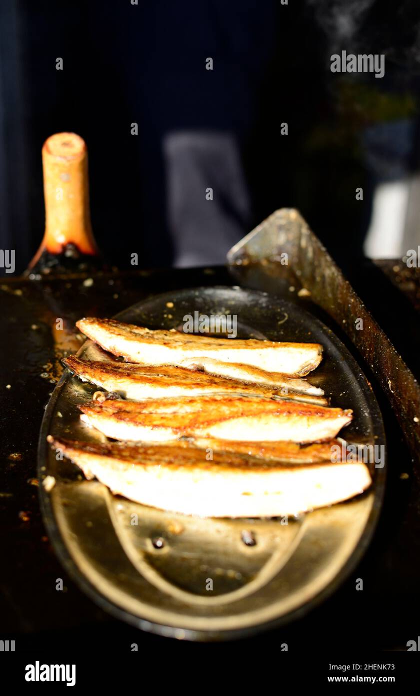 Cooking Mackerel fish for the popular fish sandwich in Istanbul, Turkey
