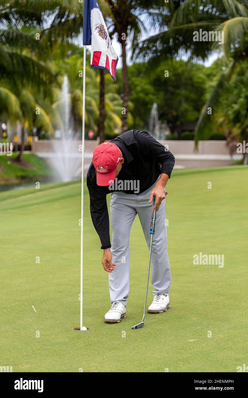 Golf player teeing off. Man hitting golf ball from tee box at Golf Club