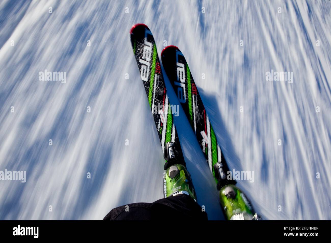 Motion blur of Alpine skis on a downhill run. Stock Photo