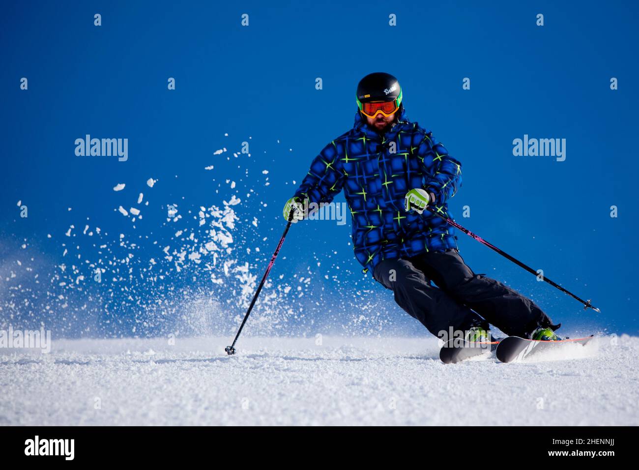 Alpine skier racing down 'The Big Dipper' at Falls Creek Ski Resort, Victoria. Stock Photo