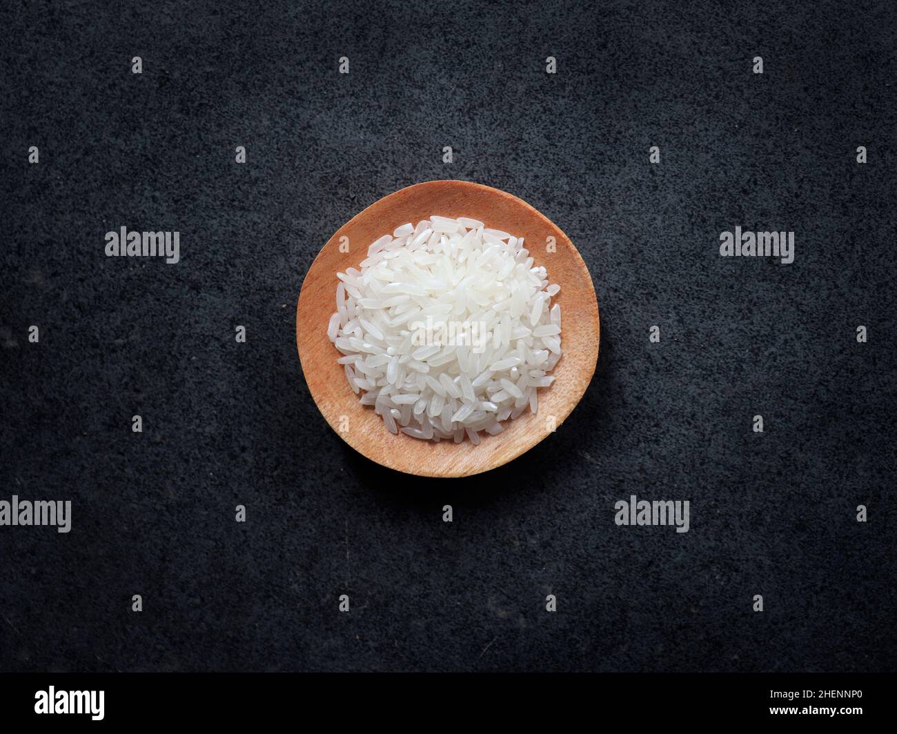 Rice on a wooden plate Stock Photo