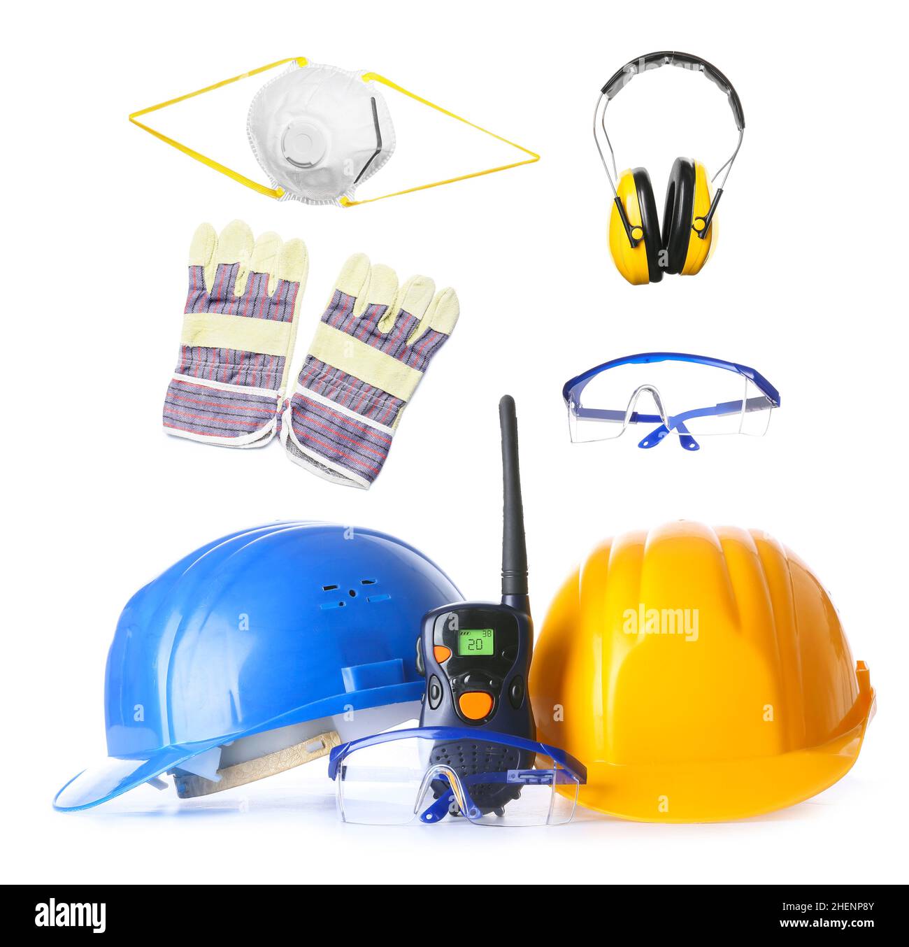Set of safety equipment and radio transmitter on white background Stock
