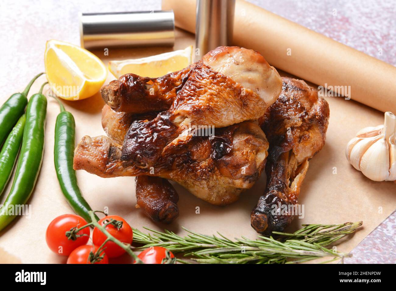 Tasty cooked chicken drumsticks on table Stock Photo - Alamy