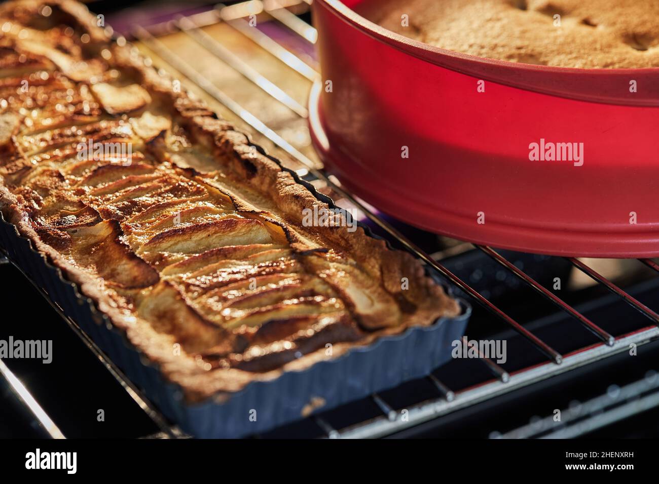 Apple pie and grape pie in the oven after baking Stock Photo