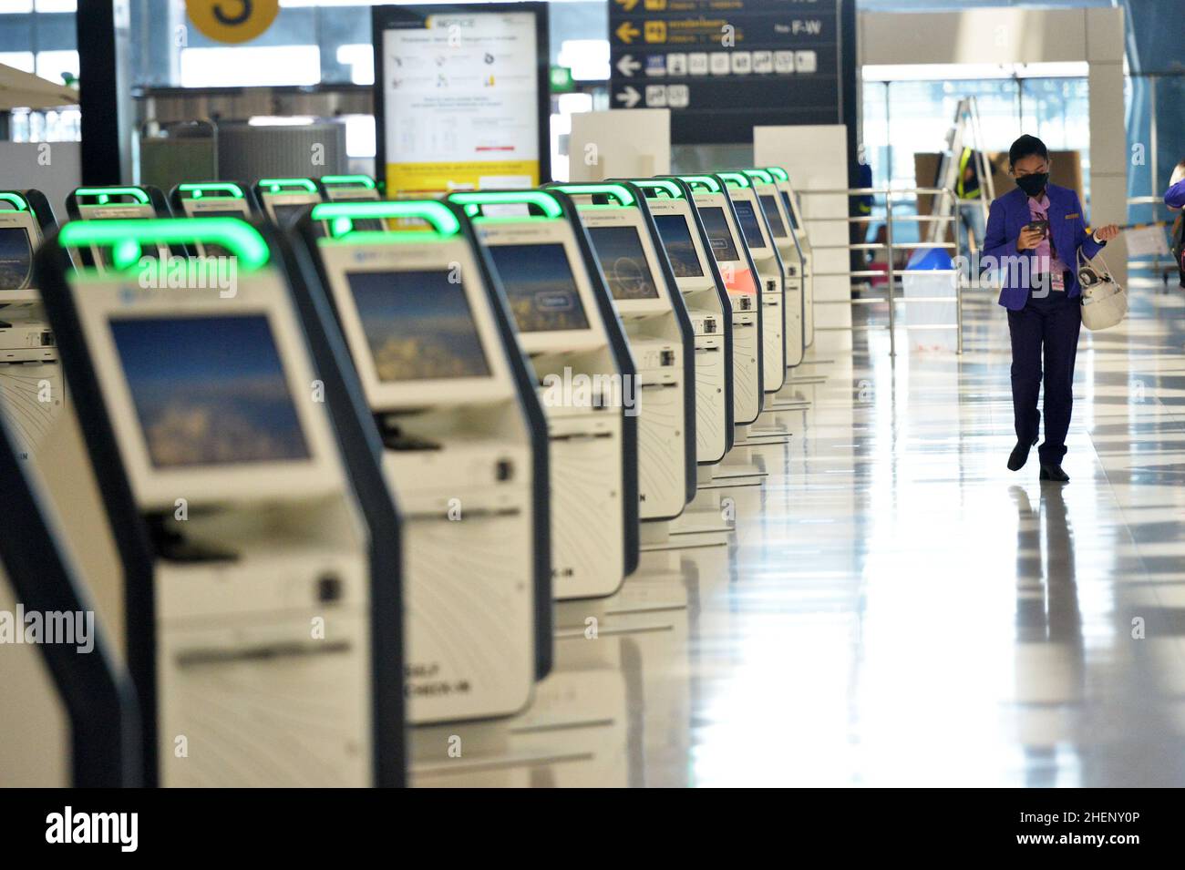BANGKOK, Jan. 12, 2022 (Xinhua) -- A staff member is seen at the Suvarnabhumi International Airport in Bangkok, Thailand, Jan. 11, 2022. Due to concerns about a new wave of COVID-19 outbreak, Thailand halted the quarantine-free travel scheme from Dec. 22, 2021 and most of its Sandbox Program, which enables quarantine-free entry while requiring visitors to stay in a specific destination for seven days with free movement during their stay, except for the resort island of Phuket. According to the Center for COVID-19 Situation Administration, from Jan. 11 onwards, Thailand will allow Stock Photo