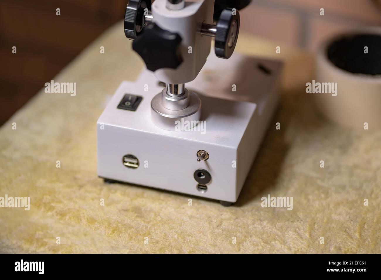 Stereo Microscope for repairing cell phone Mobile Phone Repair with Top and Bottom LED Light. Stock Photo