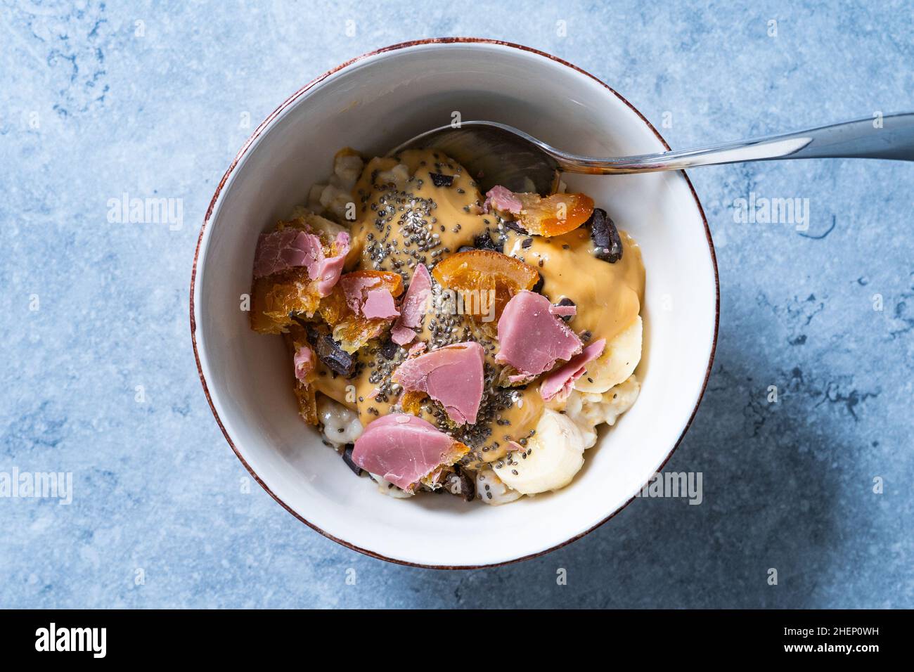 Porridge with Ruby Chocolate, Candied Orange Slices and Chia Seeds. Ready to Eat. Stock Photo