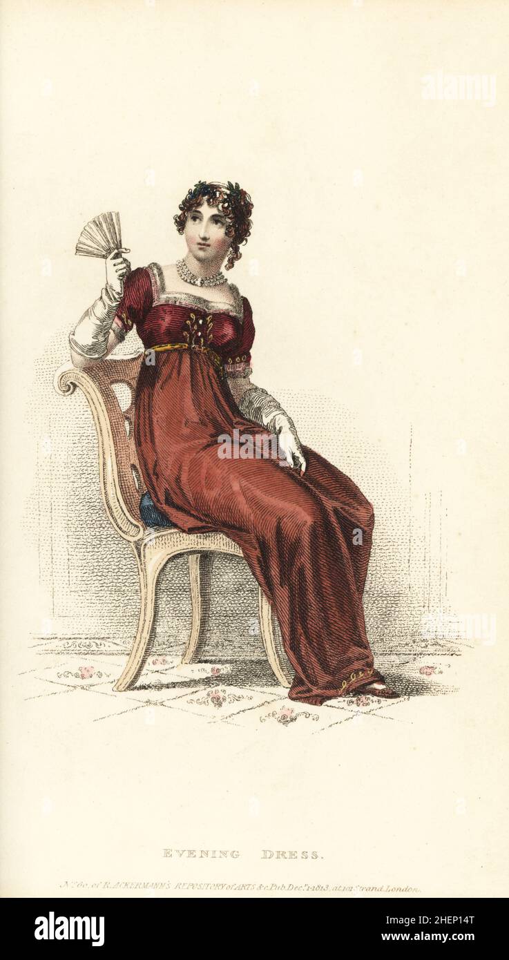 Robe of morone or crimson Merino with gold embroidered border, satin bodice trimmed with gold braid and frog, hair in dishevelled curls and autumn flowers, velvet slippers. Designed by tailor and habit-maker Mr Barry, 55 New Bond Street. Plate 41, Vol. 10, Dec 1 1813. Stock Photo